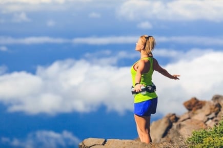 happy-woman-runner-arms-raised-outstretched-PMVPS3H-159881-edited
